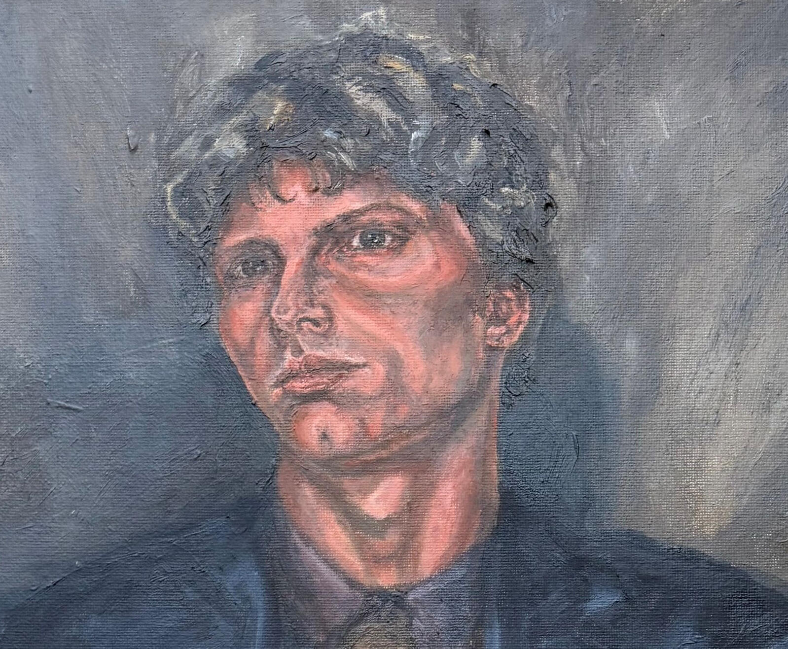 Portrait of young man in a dark suit